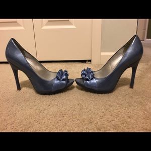 Carlos Santana patent blue pumps
